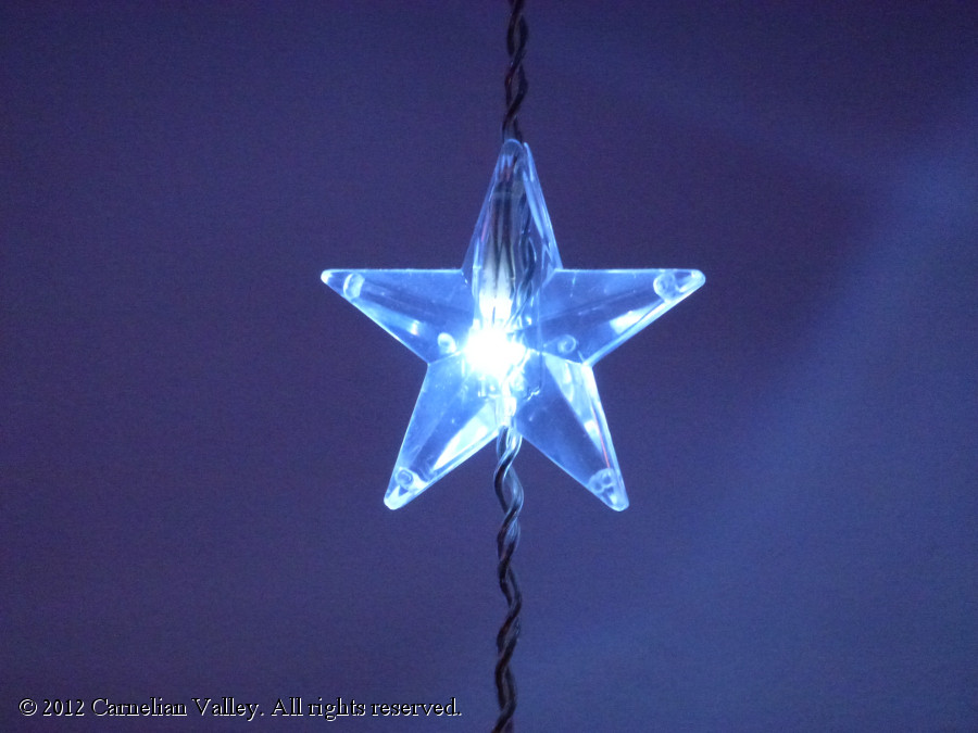 A photograph of fairy light in the shape of a star