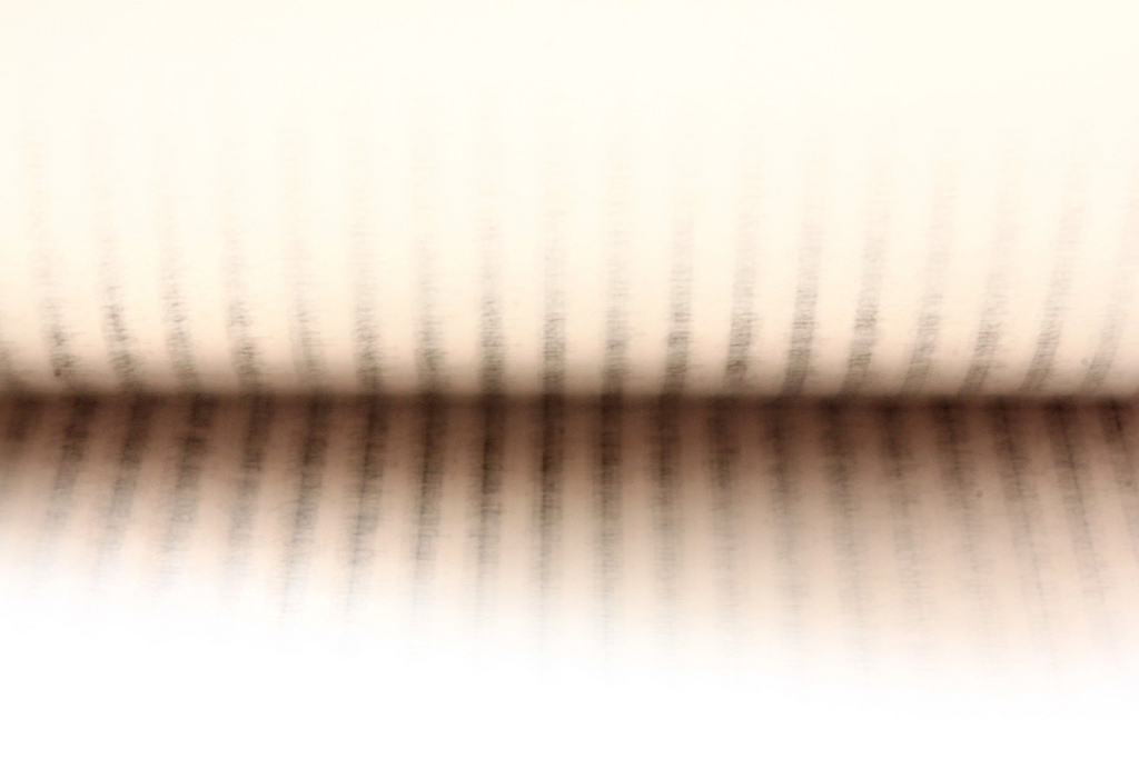 A photo of pages of a book being flicked through
