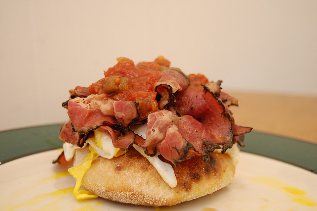 A photo of a bialy with egg and pastrami