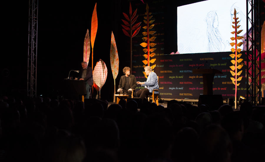 A photograph of Chris Riddell, Neil Gaiman, and Stephen Fry at the Hay Festival